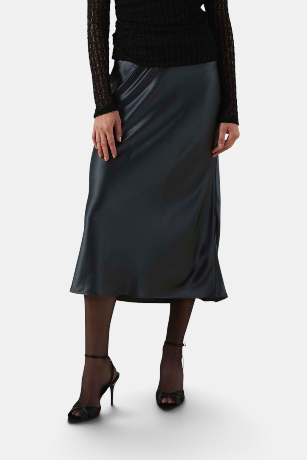 The Copper Shed Ella black satin bias-cut midi skirt with a high-rise waist and elegant flared hem.