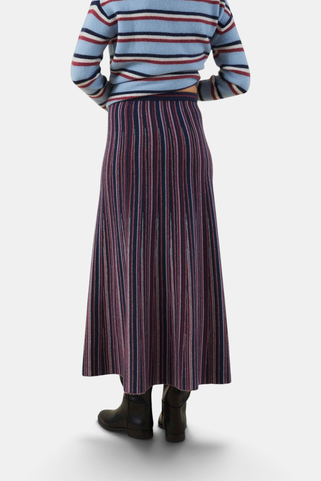 The Copper Shed Desiree08 midi skirt in a dark blue and red vertical striped knit fabric, viewed from the back.
