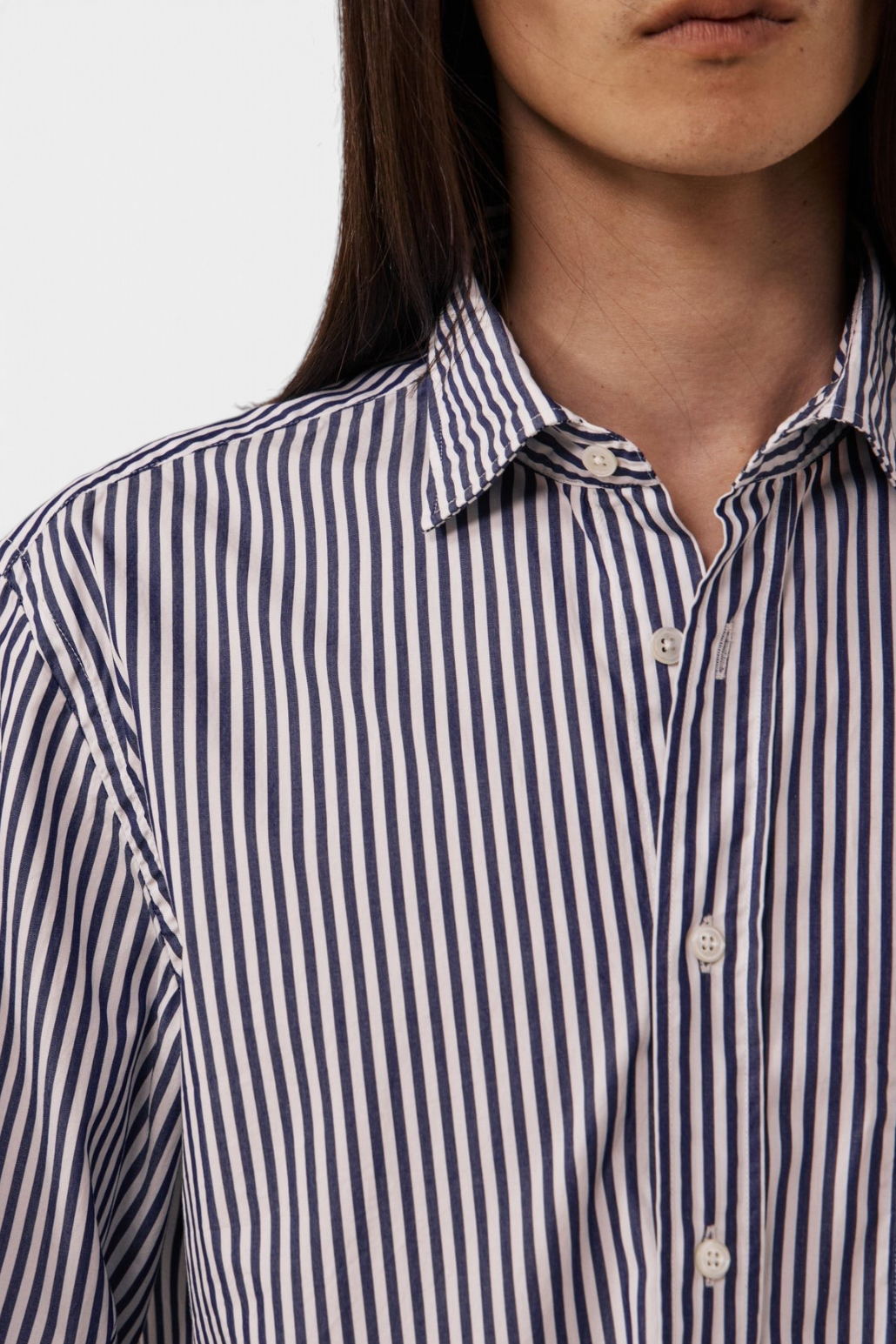 The Copper Shed Paul poplin shirt in blue and white vertical stripes with a semi-spread collar and button-front.