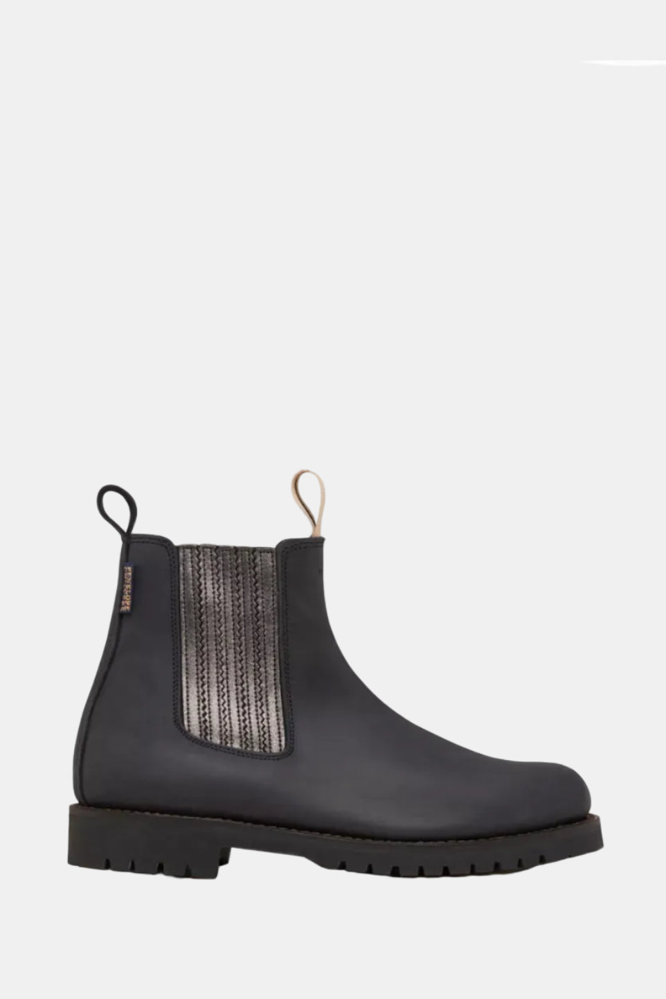 Black Chelsea boot with a patterned side panel on a white background