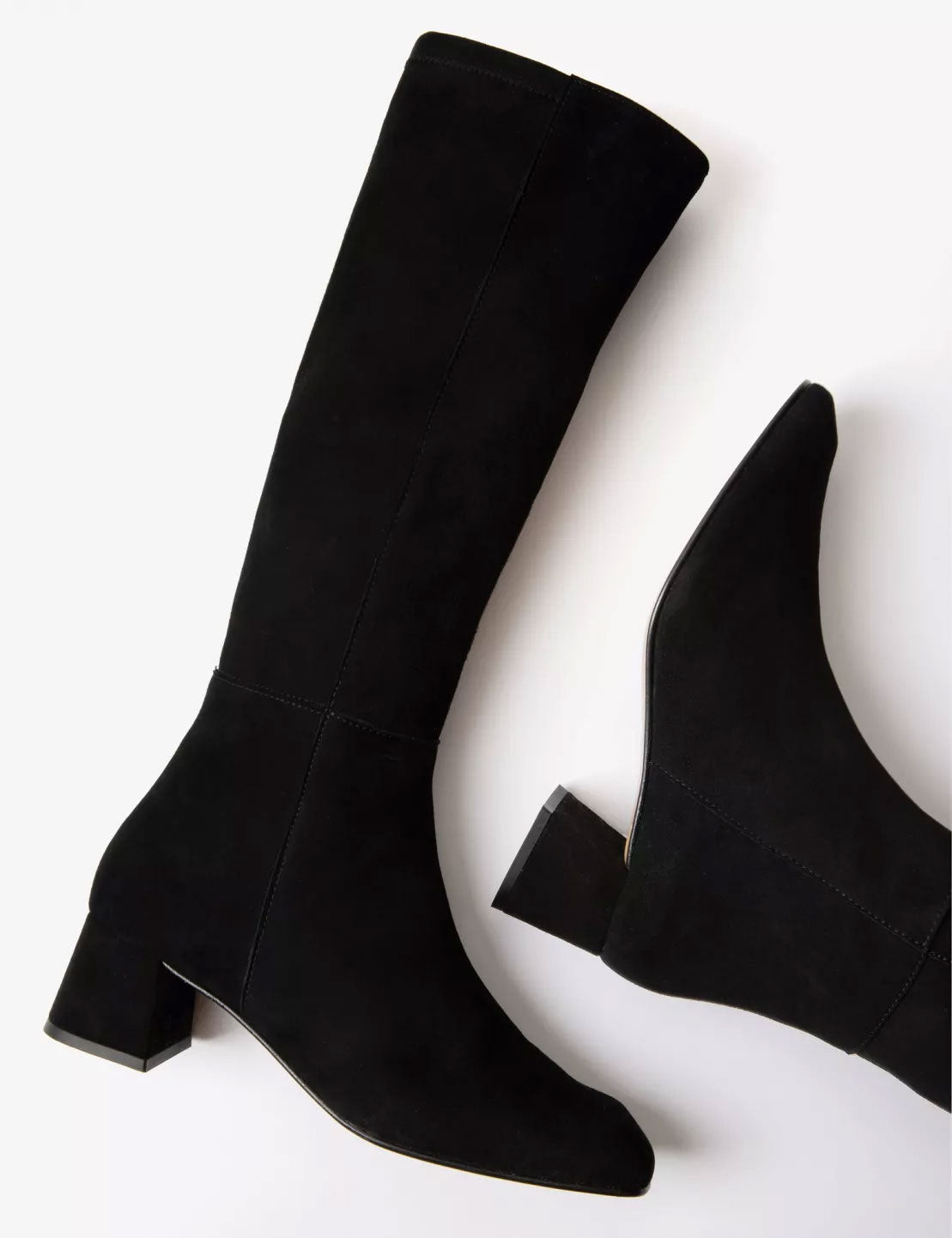 Black knee-high boots on a white background