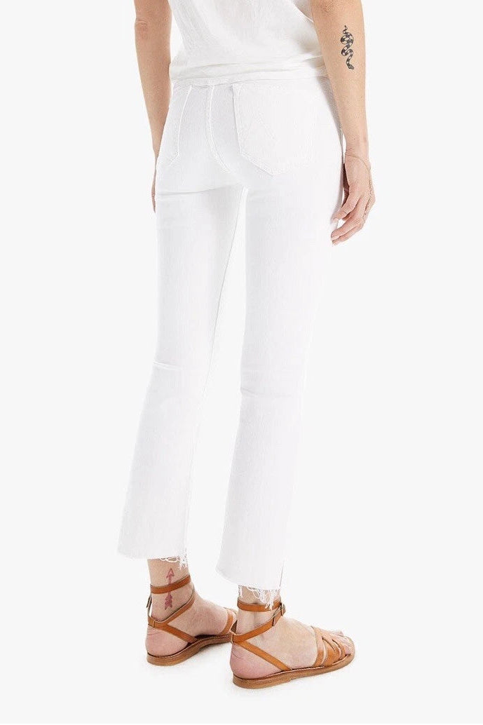 Woman wearing a white outfit on a white background