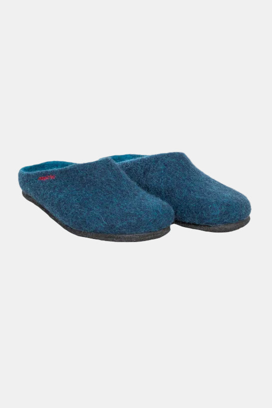 A pair of blue felt slip-on slippers with dark gray soles, photographed on a clean white background. The brand name 'satchi' is embroidered in red on the side of the left slipper.