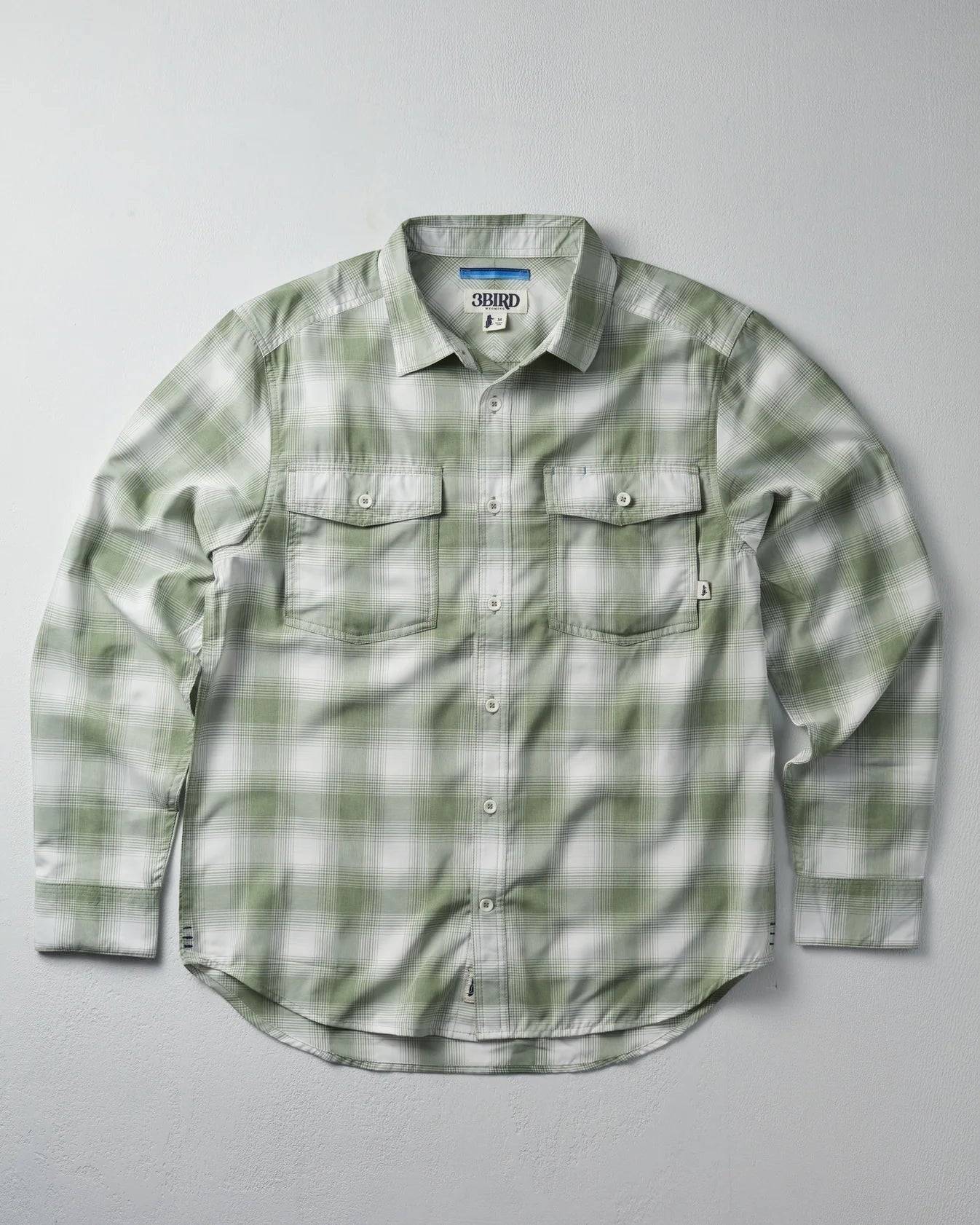 The 3bird Kingfisher LS Shirt in light green and white plaid. Lightweight performance stretch woven shirt with UPF 50+ protection.