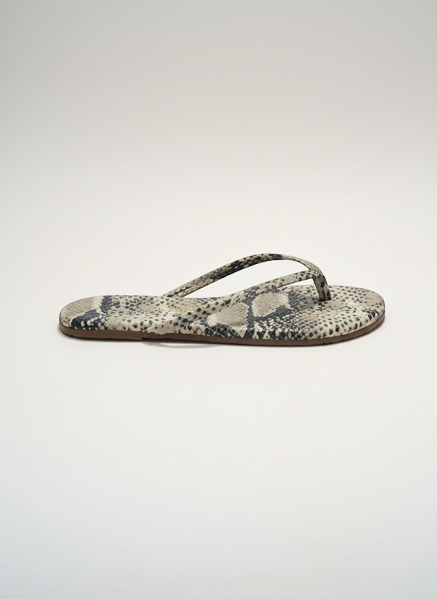 The TKEES Lily Flip Flop in a grey and black snakeskin pattern. Soft leather-like material with cushioned insole.