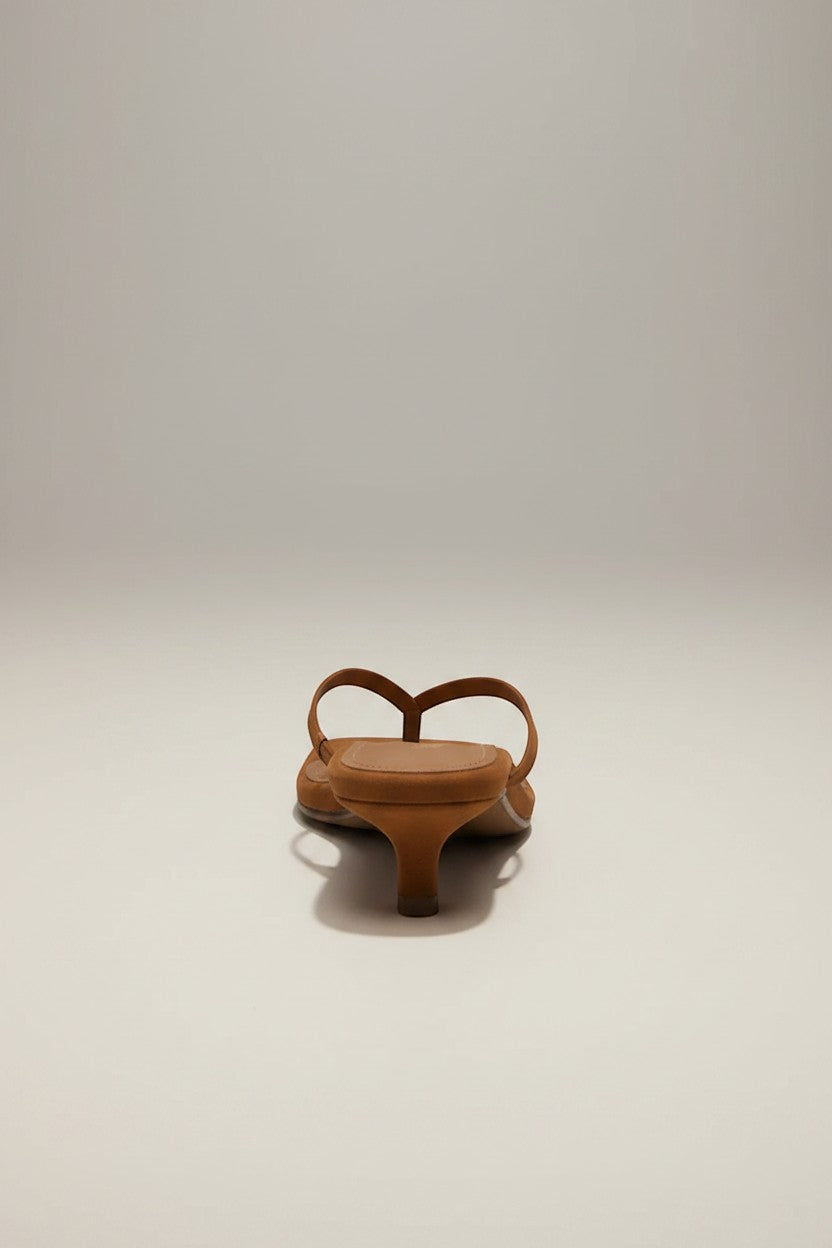 The TKEES Square Toe Julia Suede thong sandals in tan with a low kitten heel and minimalist straps.