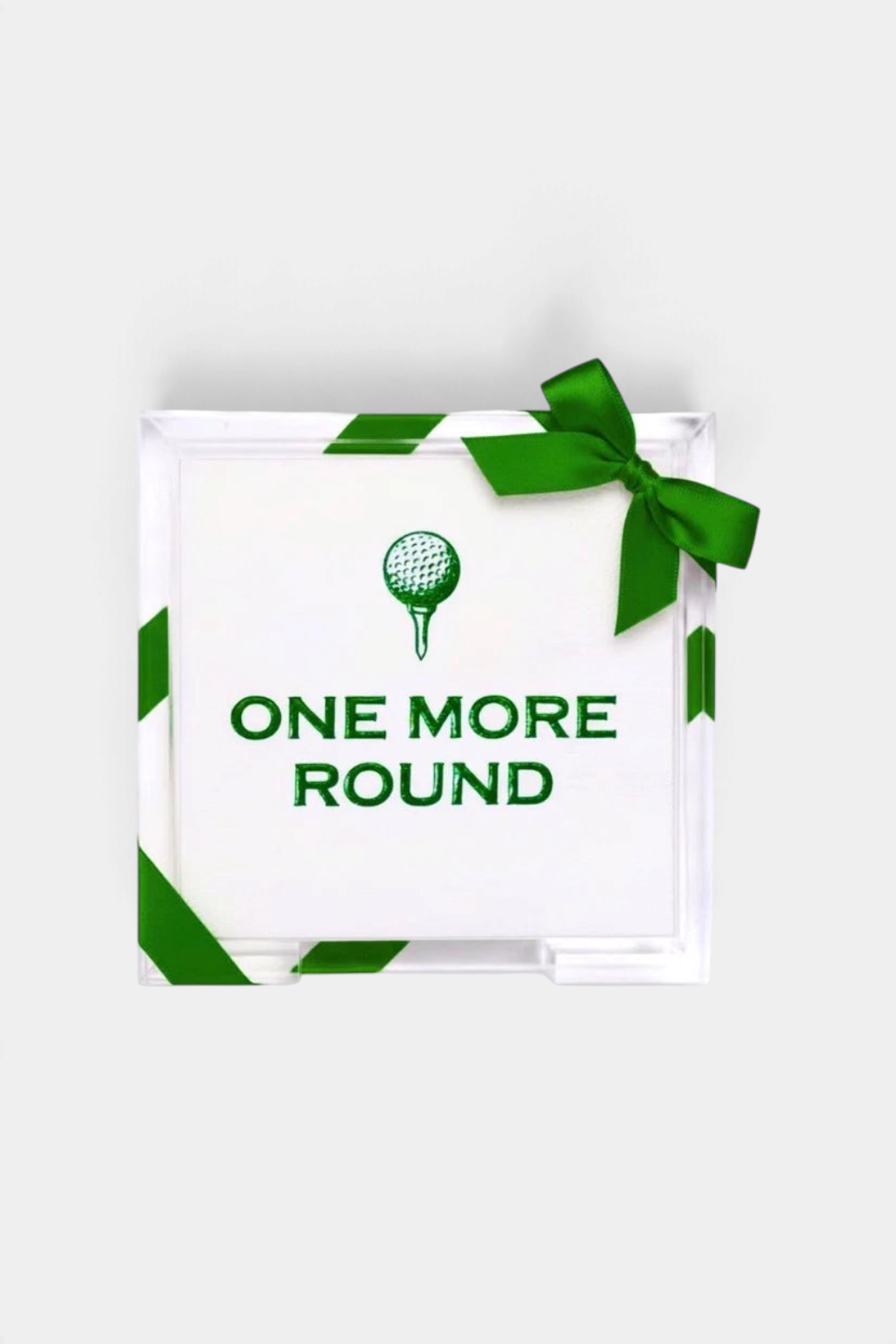 The Copper Shed acrylic hostess tray with green One More Round golf guest towels and a decorative green ribbon bow.