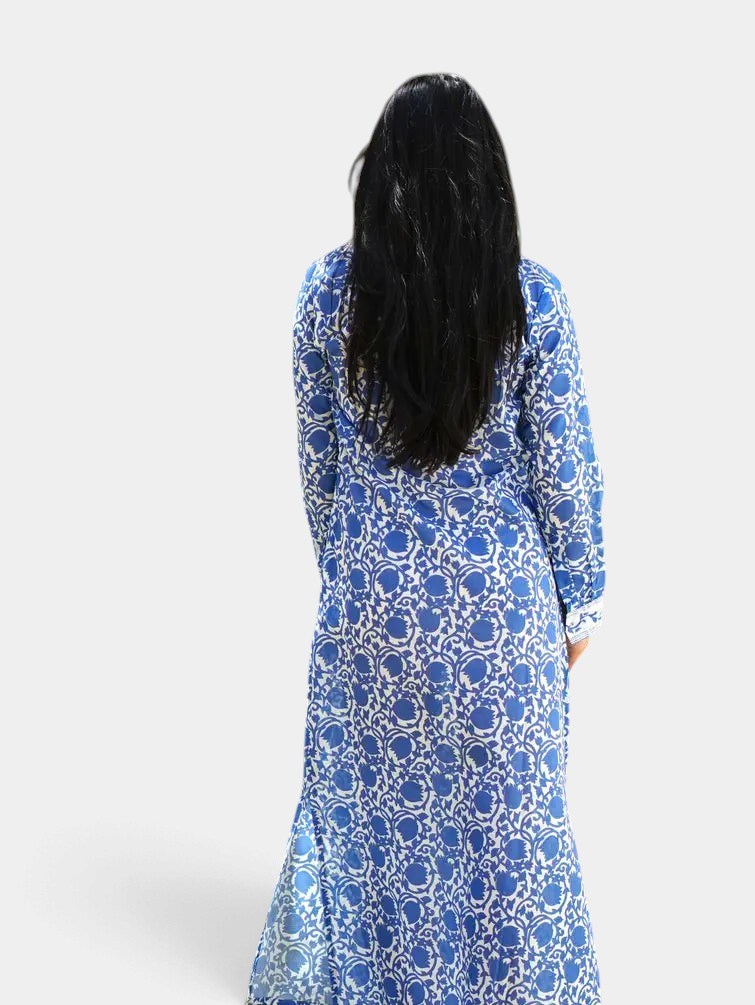 The Copper Shed Adriana maxi shirt dress in blue and white floral print with long sleeves and side slits, back view