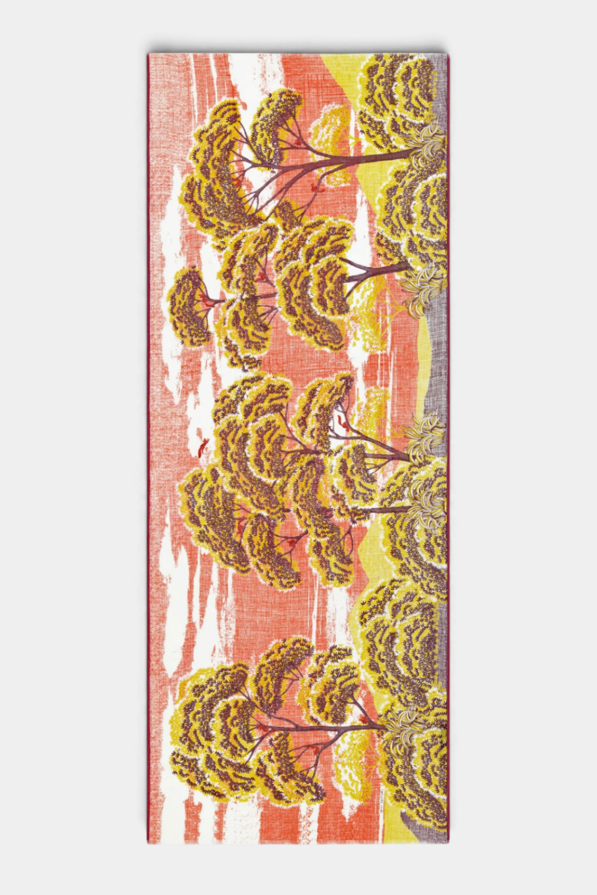 The Copper Shed Ambroise linen and cotton scarf featuring a vibrant orange and yellow hand-printed tree landscape