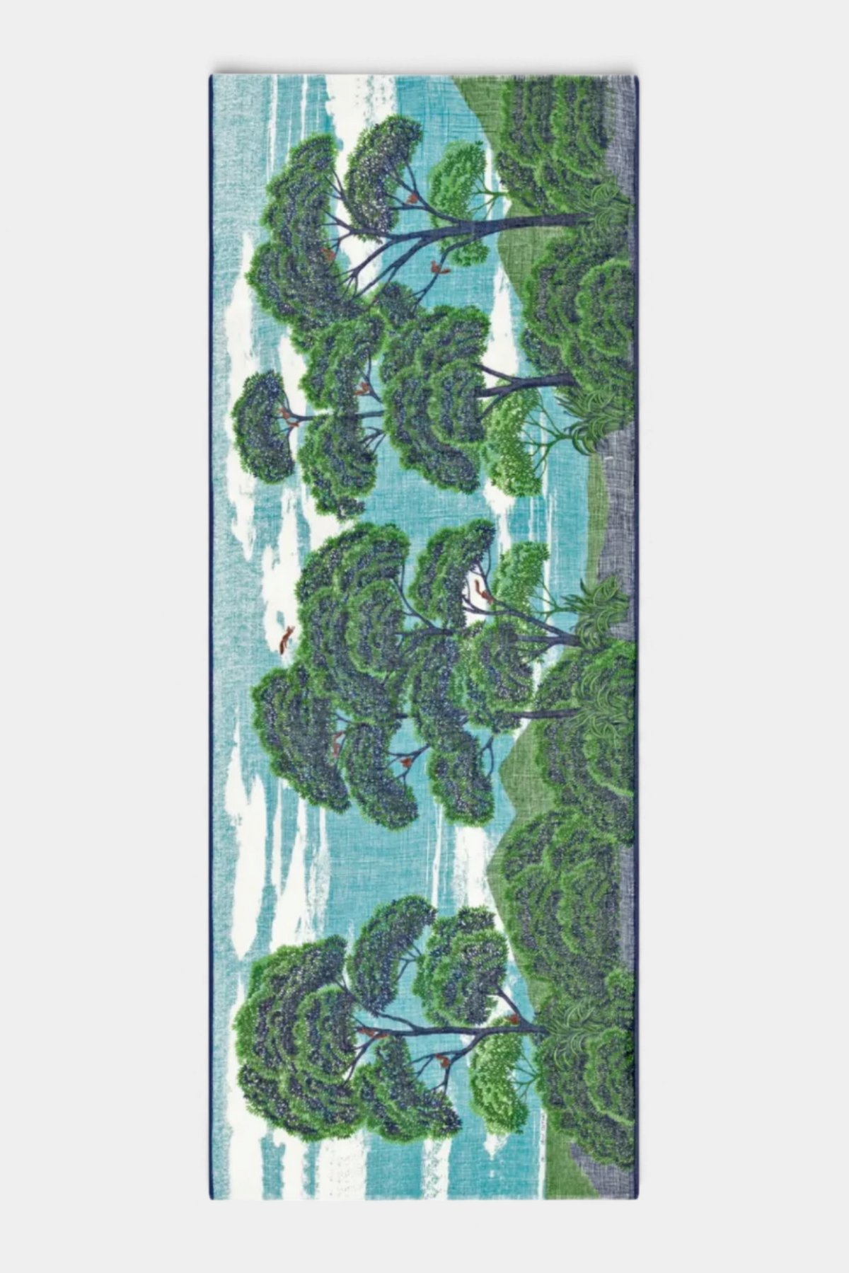 The Copper Shed Ambroise scarf in linen and cotton blend featuring a hand-printed landscape of green trees and sky.