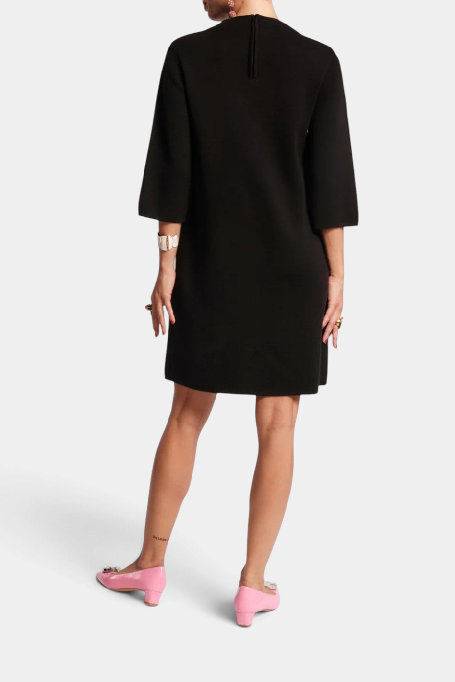 Back view of The Copper Shed Annie black merino wool-blend mini dress with three-quarter sleeves and back zipper