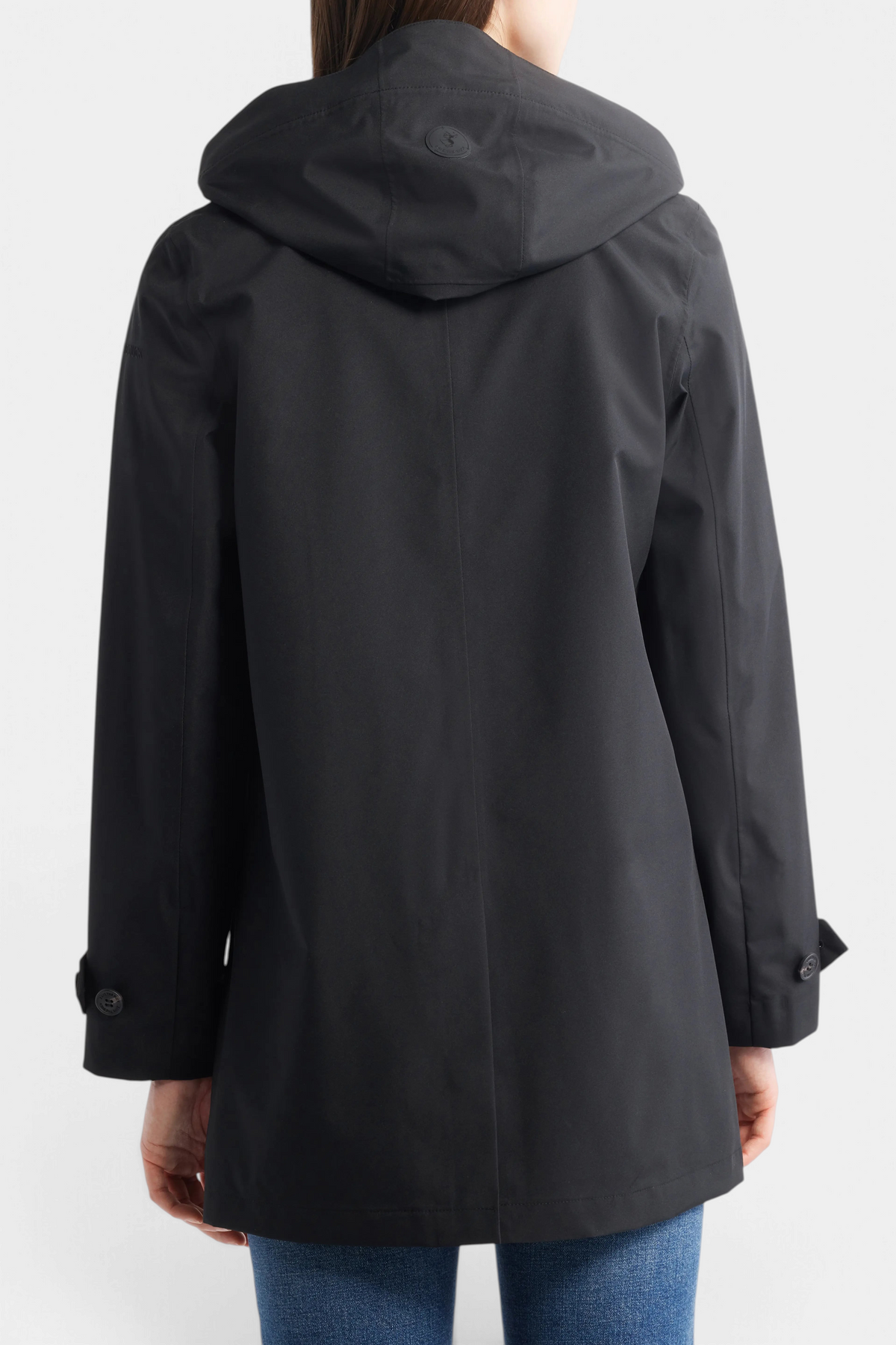 The Copper Shed April hooded raincoat in black, featuring a detachable hood and water-repellent polyester fabric.