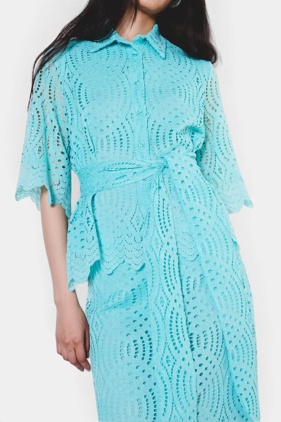 The Copper Shed aqua blue eyelet lace collared blouse with a tie waist and short sleeves.