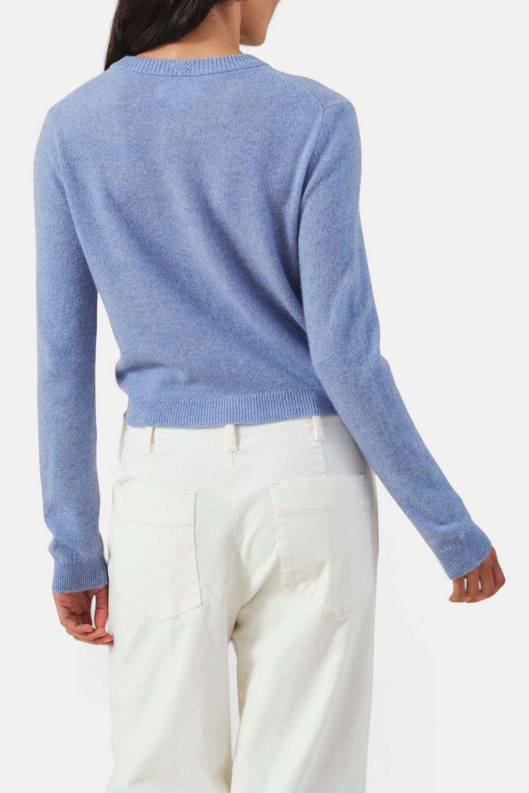 The Copper Shed Aylina blue cashmere cardigan, back view showing ribbed trim and cropped fit.