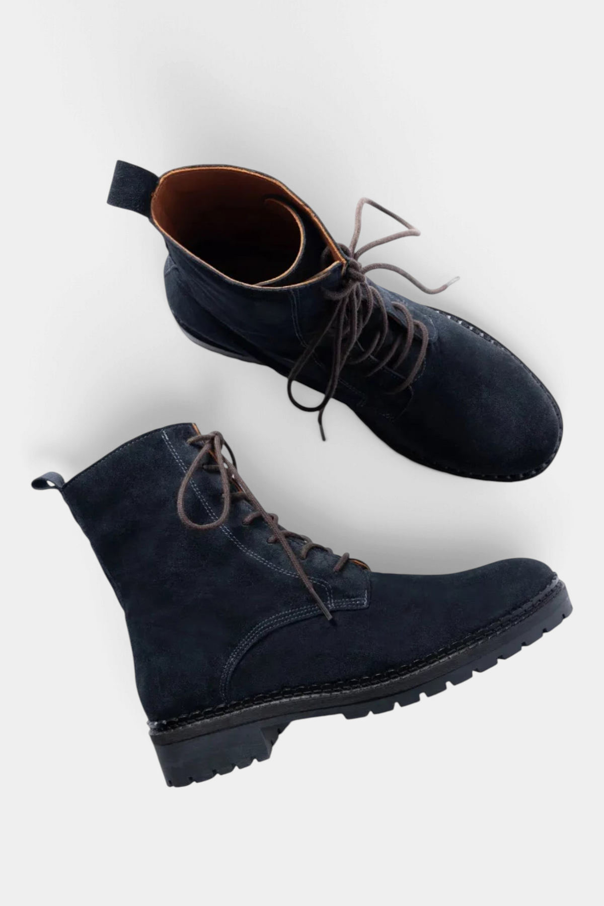 The Copper Shed Bartholomew navy split suede lace-up boots with brown laces and a scalloped rubber tread sole.
