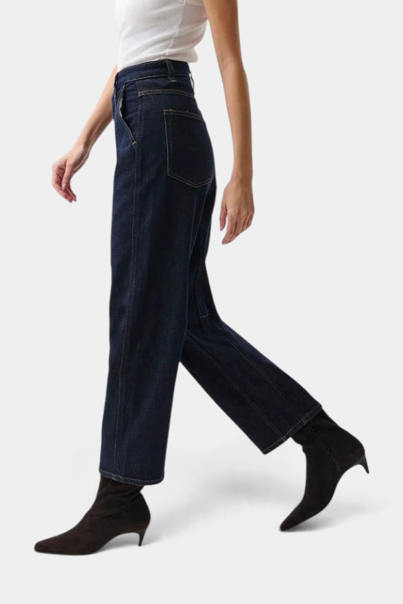 The Copper Shed Beau Seamed Crescent dark wash rigid denim jeans with architectural seaming and a cropped inseam.