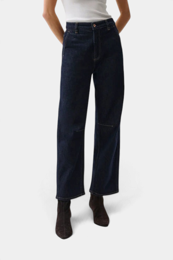 The Copper Shed Beau Seamed Crescent dark wash rigid denim jeans with architectural seaming and a cropped inseam.