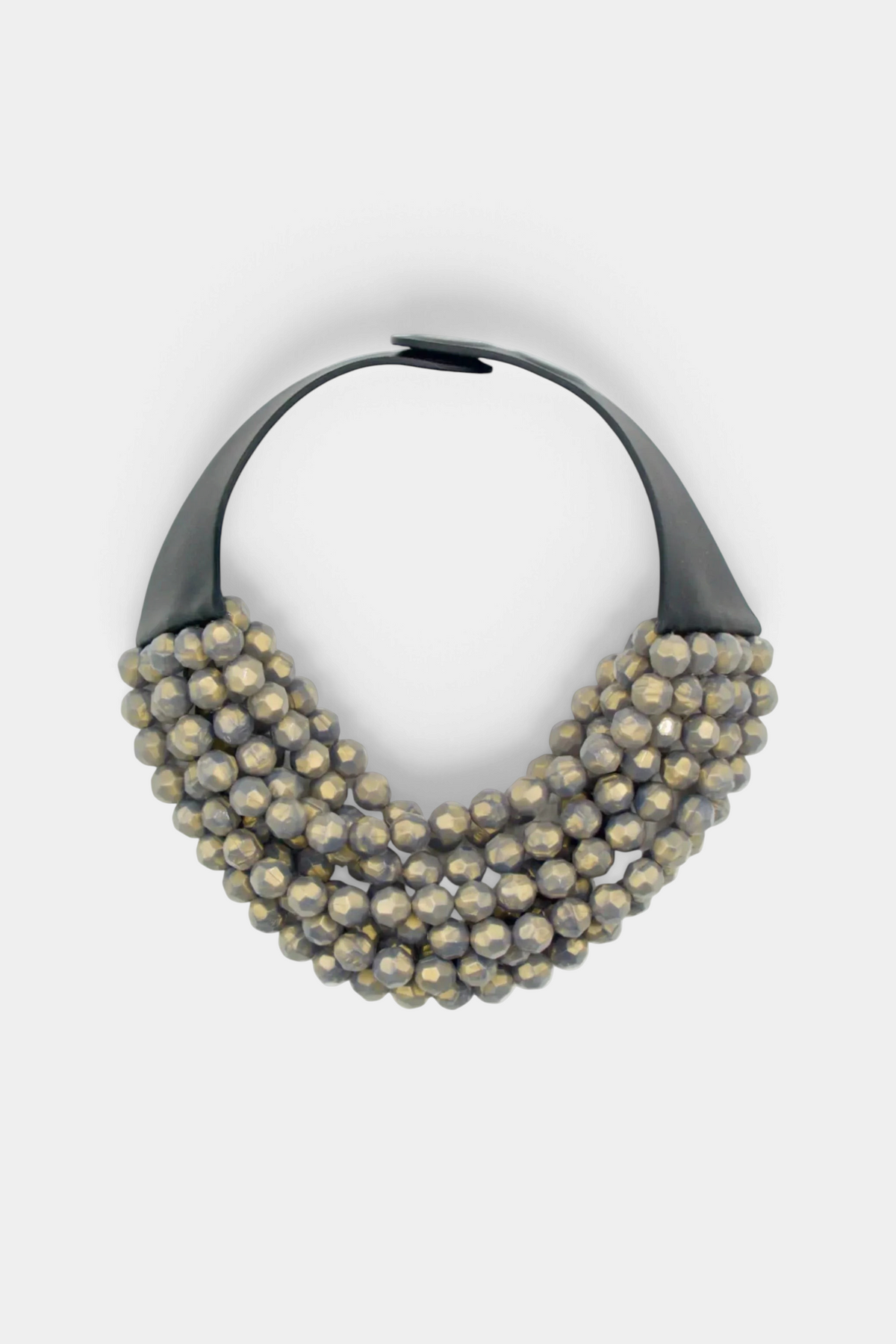 The Copper Shed Bella Grigio necklace featuring layered metallic resin beads on a black leather collar