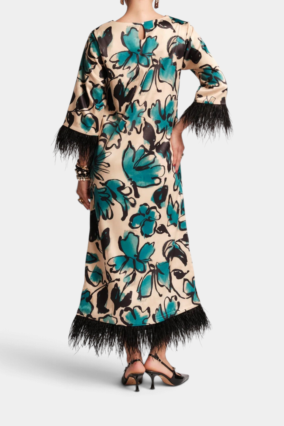 Back view of The Copper Shed Belle Maxi dress in Abstract Meadow print with black faux-feather cuffs and hem.