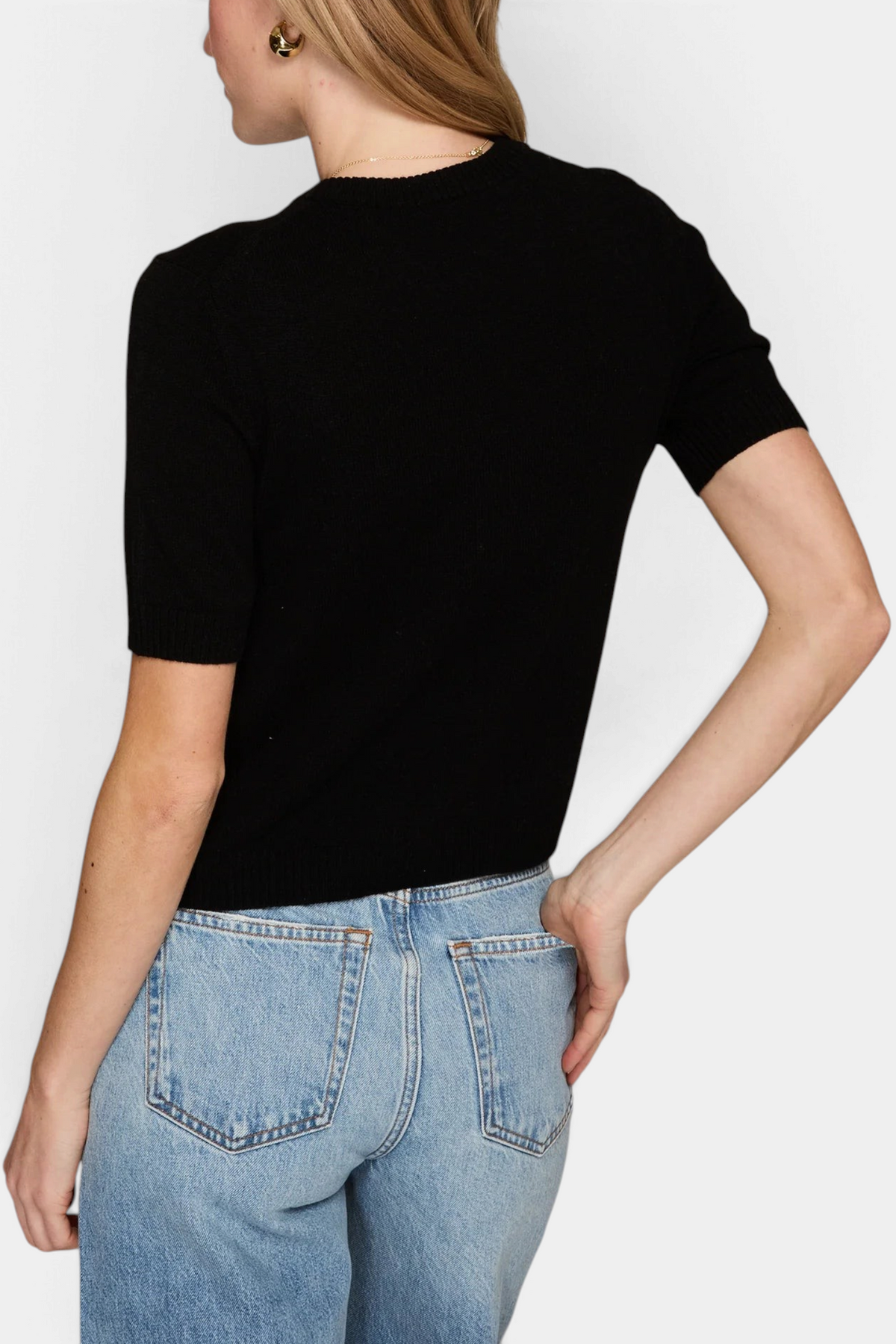 The Copper Shed Autum Cashmere black short sleeve cropped crew neck sweater with ribbed trims worn with blue jeans