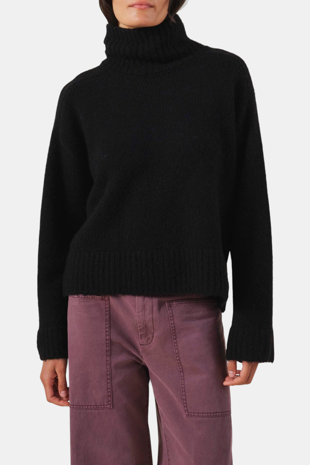 The Copper Shed black cashmere blend turtleneck sweater with ribbed trim and a relaxed fit.