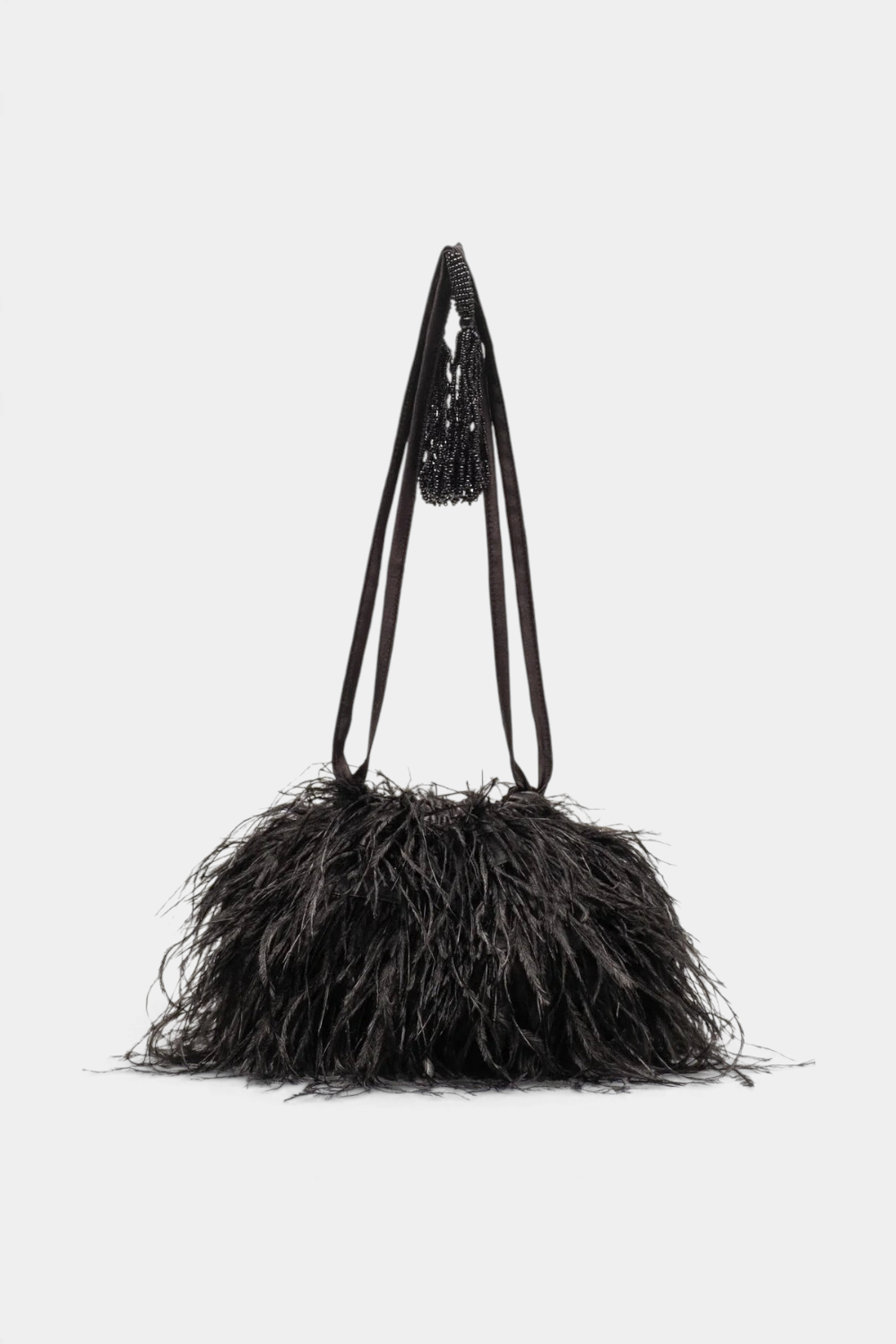 The Copper Shed black feather pouf bag with satin drawstring handles and a textured, voluminous design.