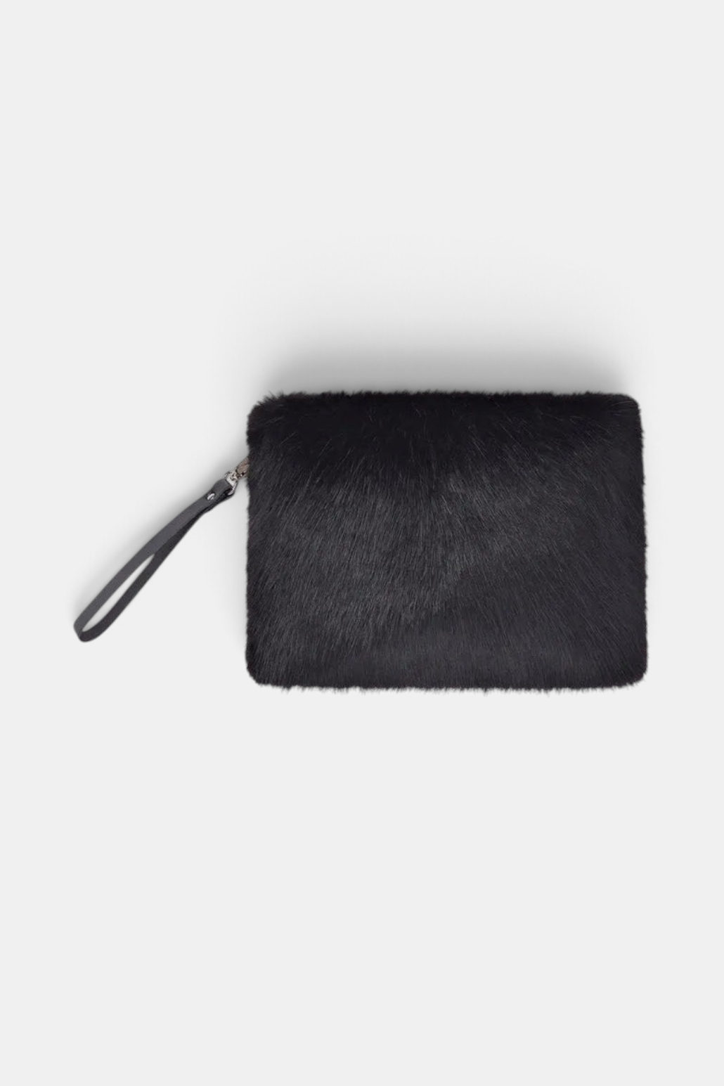 The Copper Shed black faux fur clutch bag with a detachable leather wrist strap and cotton drill lining.