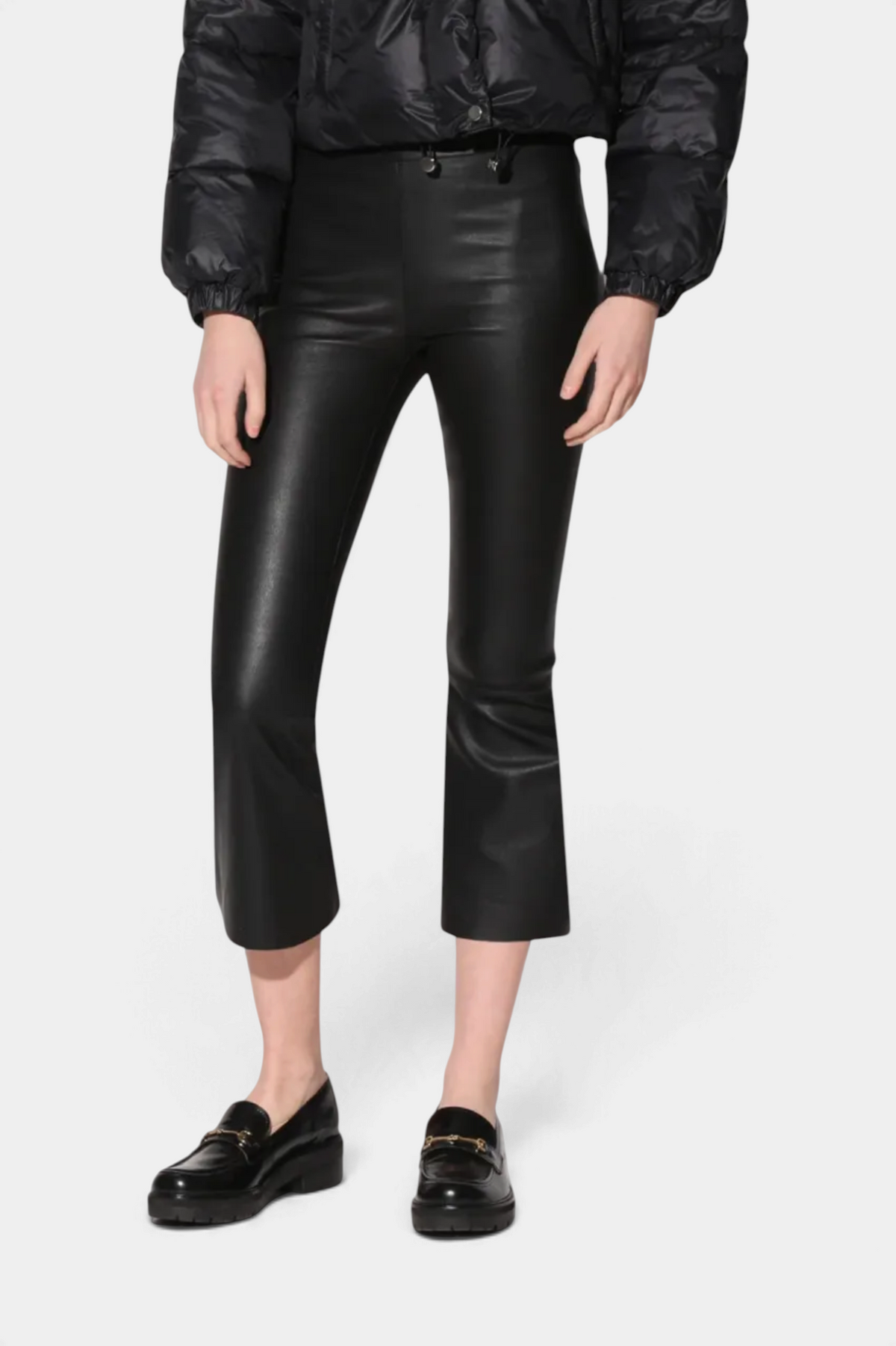 The Copper Shed Luisa Pant in black stretch leather featuring a contemporary cropped flare silhouette.