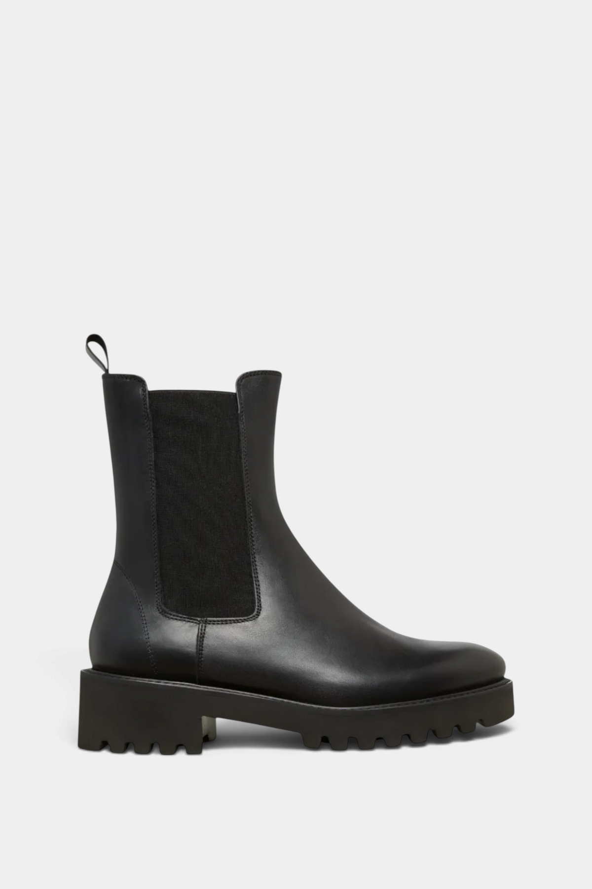 The Copper Shed black leather Chelsea boot with a lightweight lug sole and elastic side panels, side view.