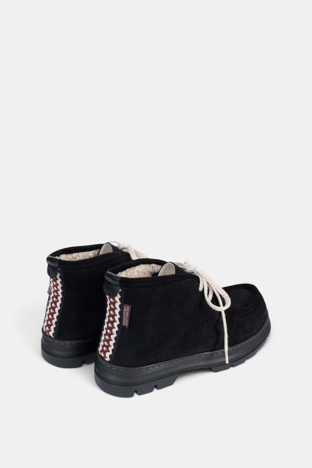 The Copper Shed black suede shearling-lined boots with ecru laces and decorative folk trim on the heel