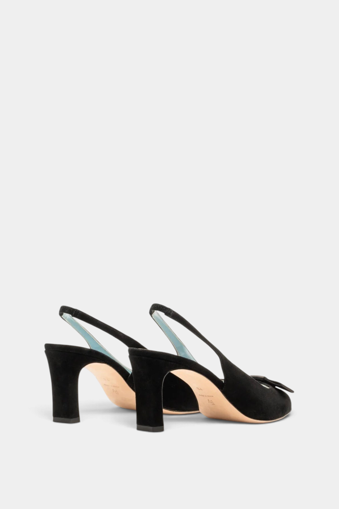 The Copper Shed Reese black suede slingback heels with bow detail, ankle strap, and 2-inch block heel.