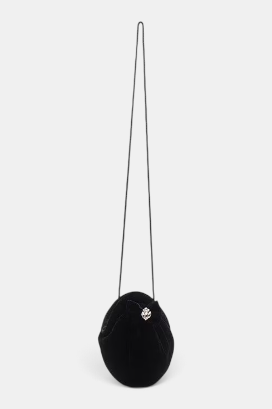 The Copper Shed black velvet oval clutch with a bow detail and a slender shoulder strap on a white background.