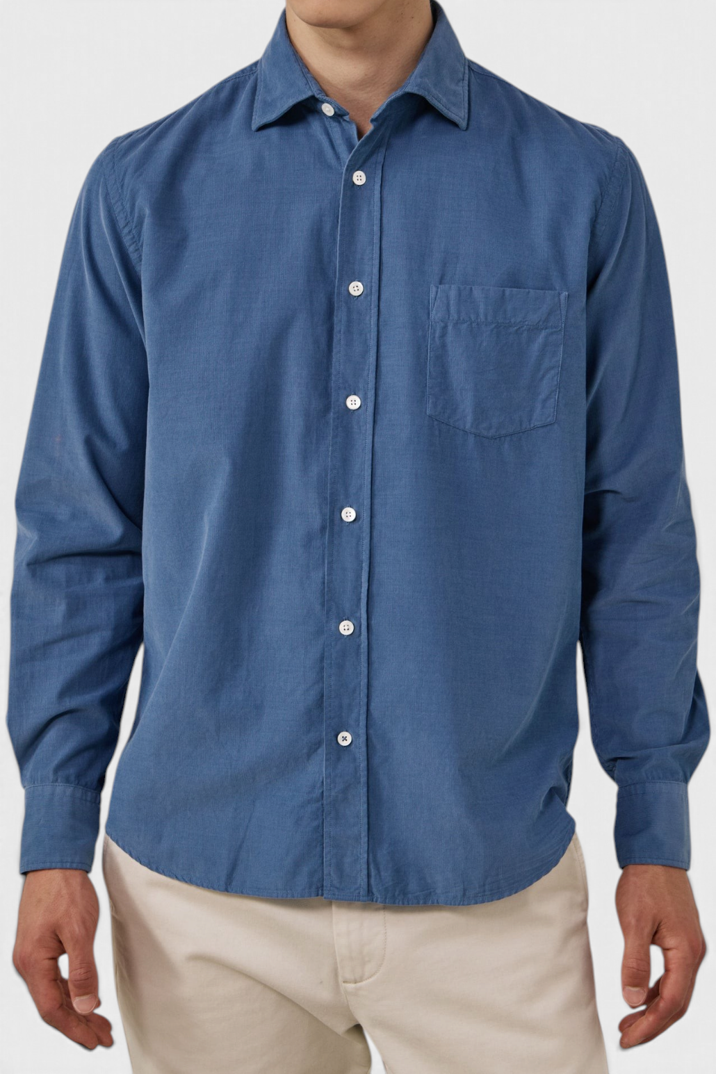 The Copper Shed blue fine corduroy shirt with button-front closure, chest pocket, and semi-spread collar.