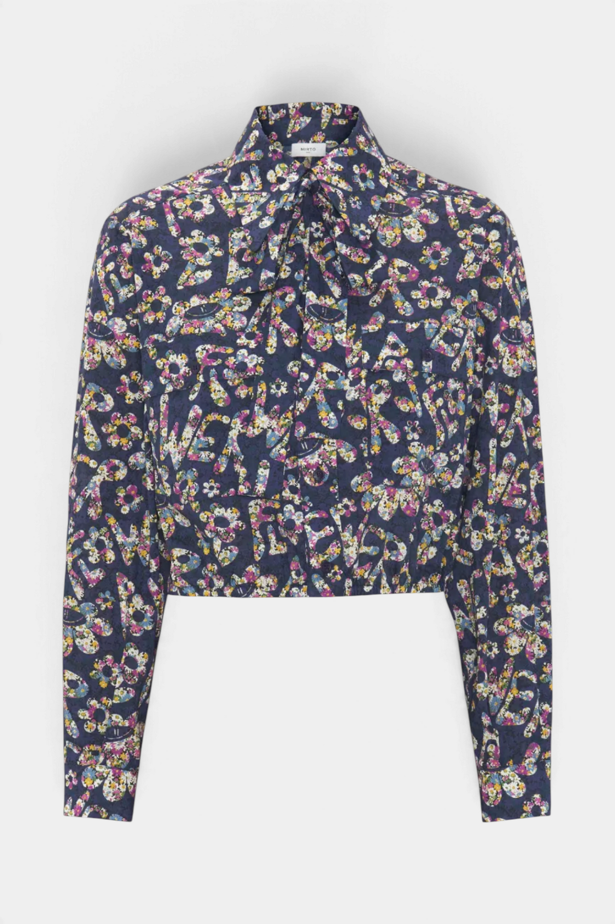 The Copper Shed blue cotton shirt with Liberty floral print, long sleeves, flap pockets, and a removable tie-up collar.