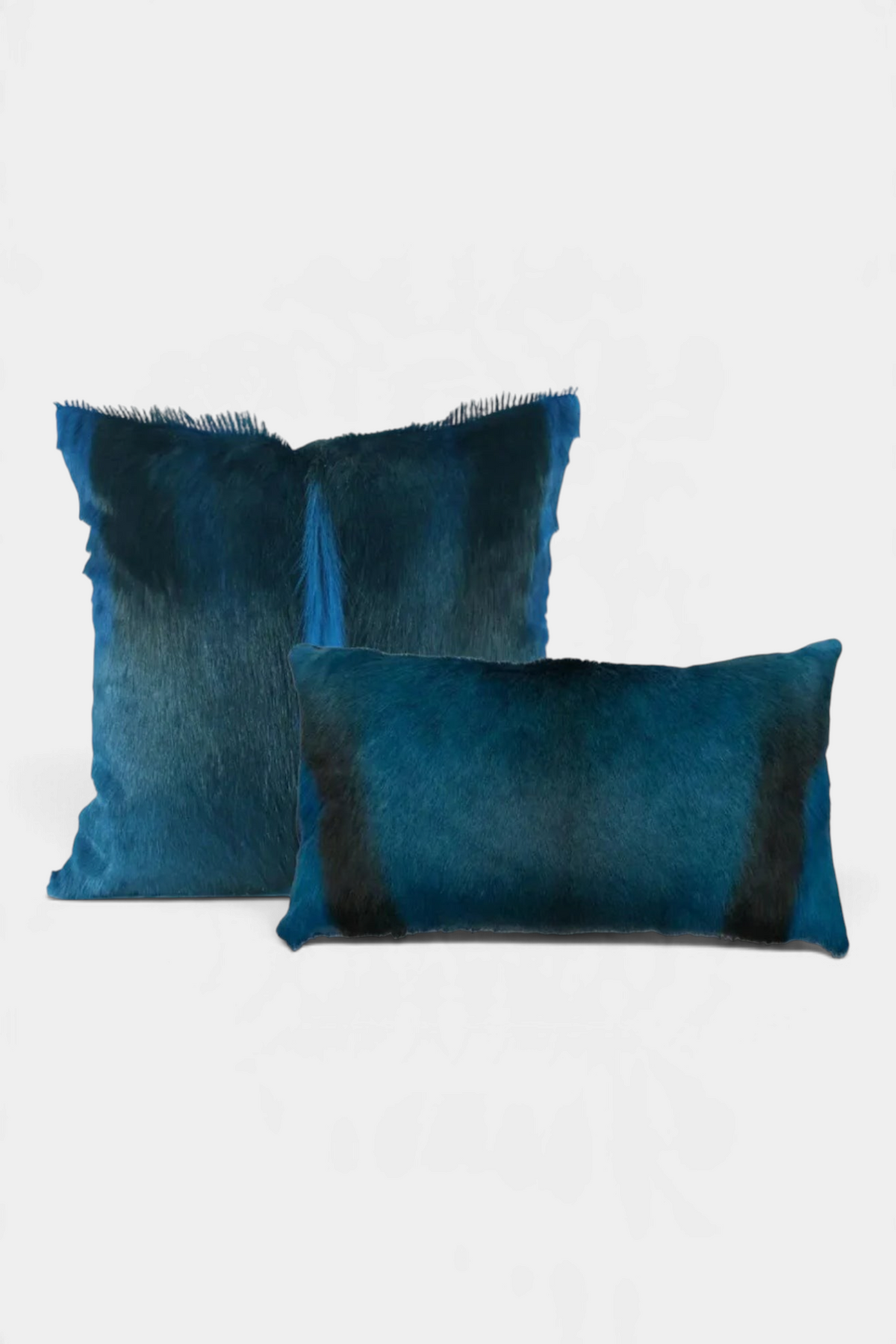 The Copper Shed blue genuine springbok fur pillows with plush ultra-suede backing and feather down filling.