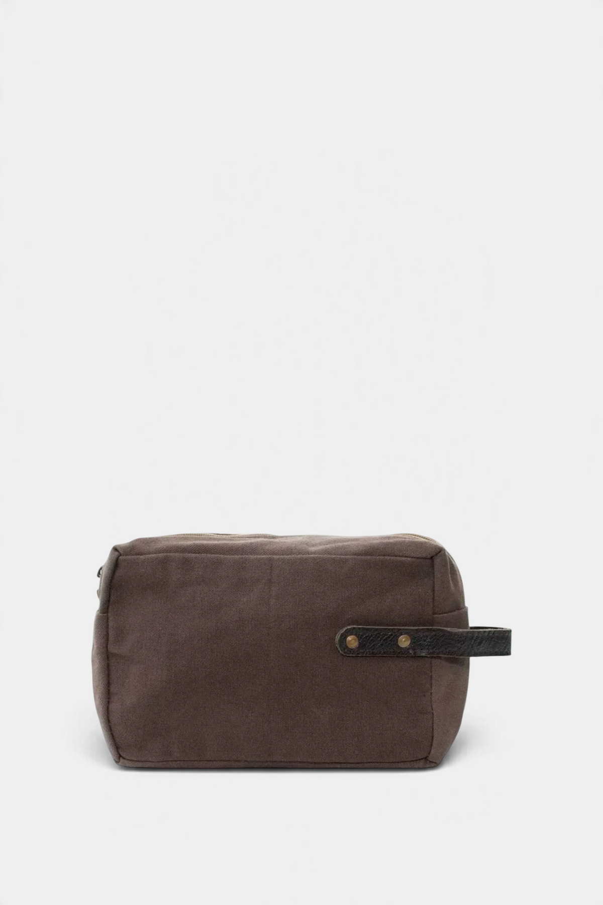 The Copper Shed brown canvas shaving bag with a leather handle and waterproof lining for grooming essentials.