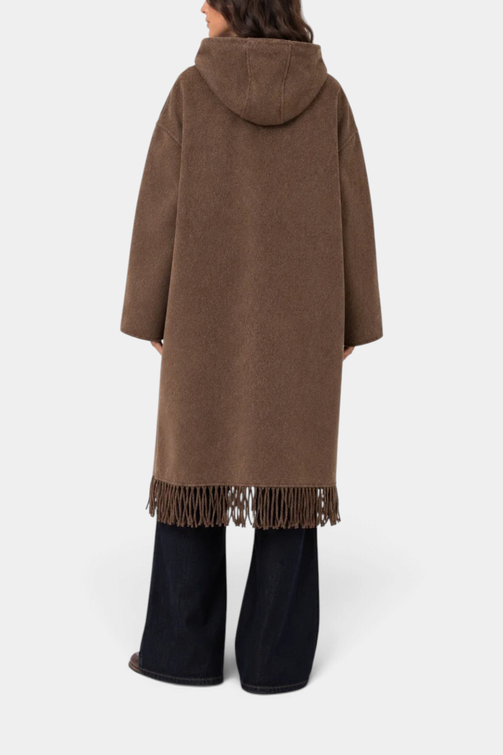 The Copper Shed nut brown wool hooded coat with fringe hem detail worn by a model from the back view.