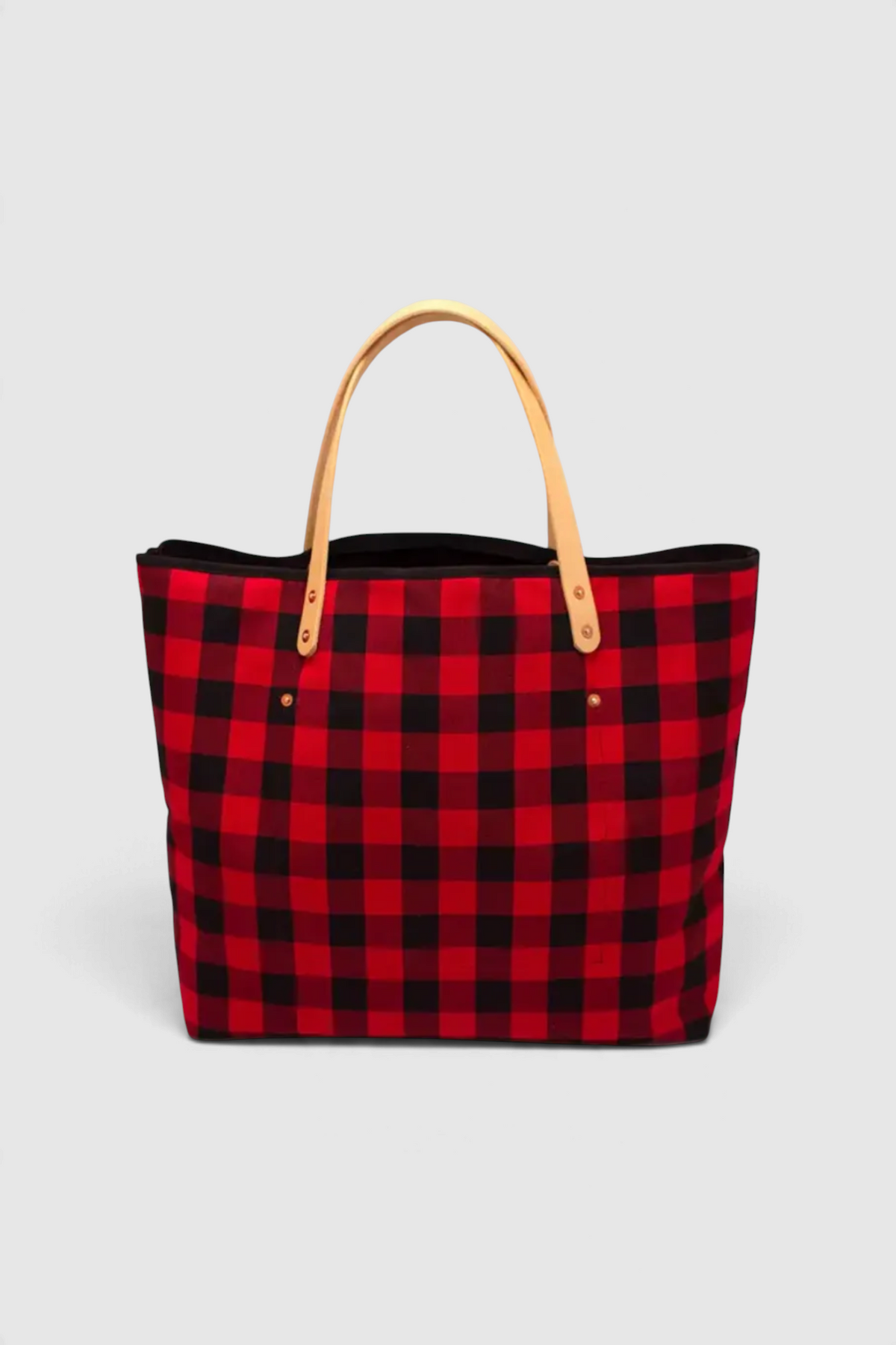The Copper Shed buffalo check cotton tote bag with blonde vegetable-tanned leather handles and copper rivet details.