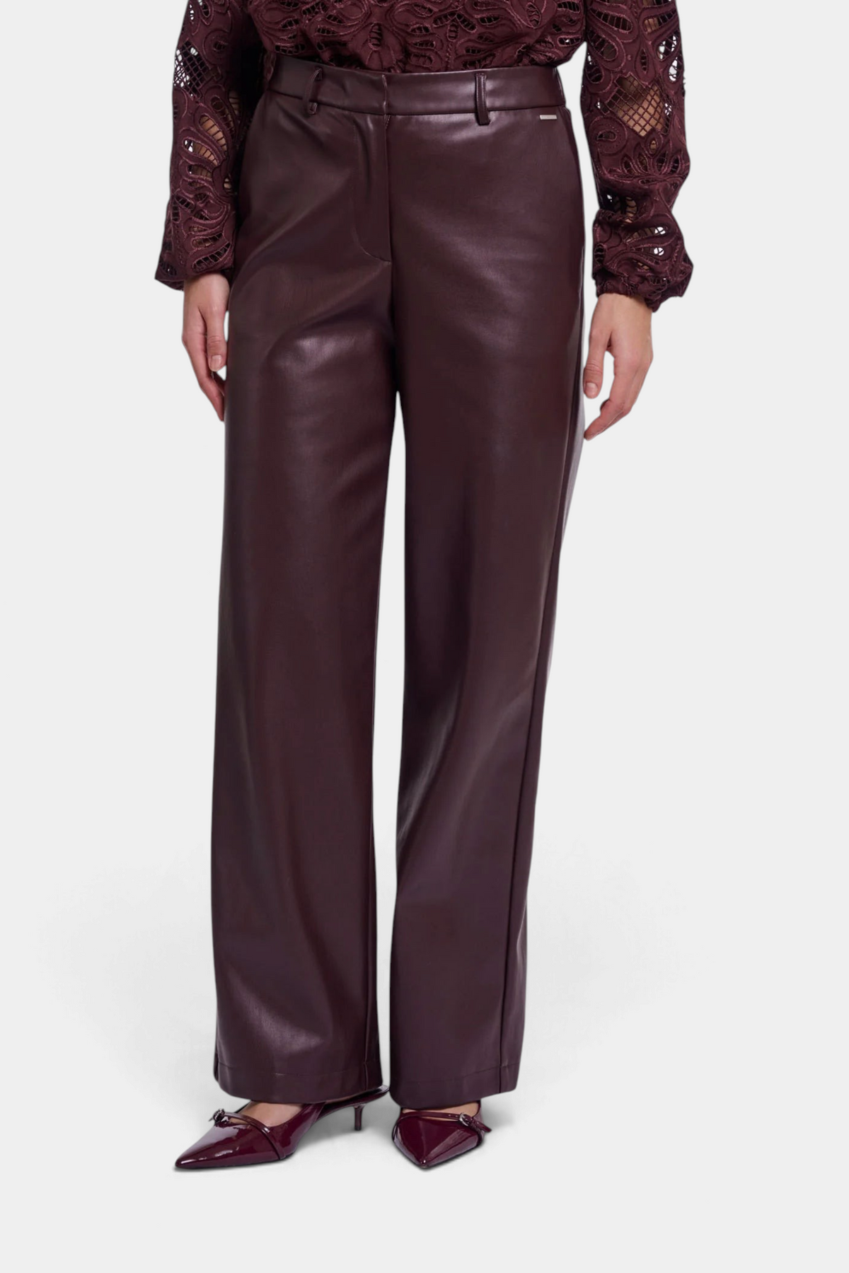 The Copper Shed Georgina straight-leg trousers in dark burgundy faux leather with an elasticated waistband.