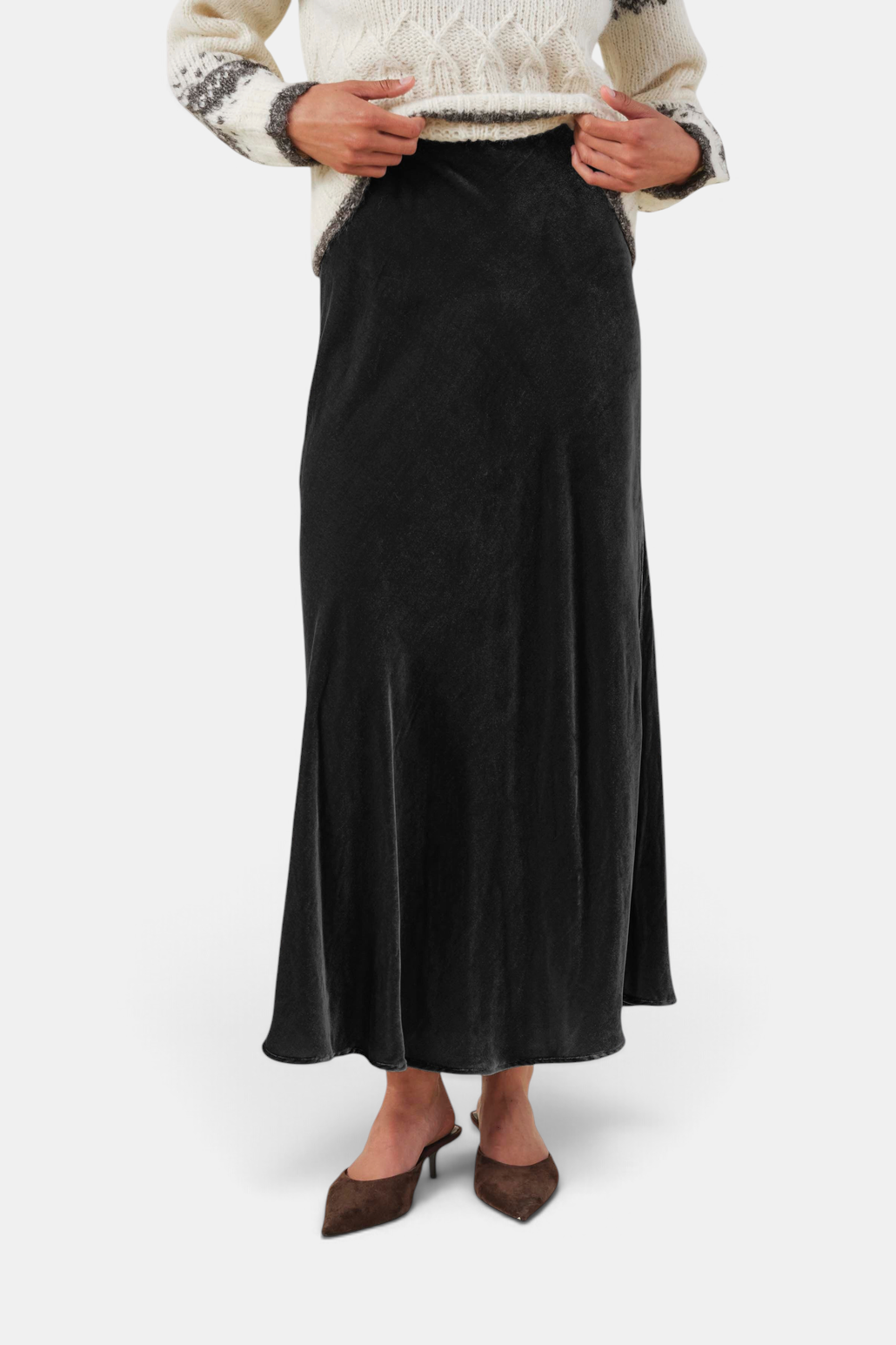 The Copper Shed Cadence black velvet maxi skirt with an A-line silhouette and elastic waist.