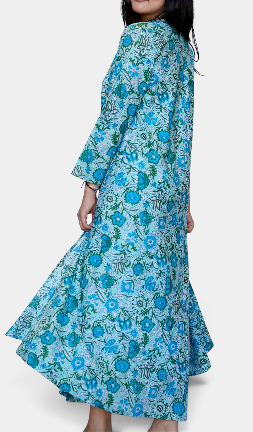 The Copper Shed Calypso dress in turquoise and sage floral cotton with a flattering a-line silhouette and side slit.