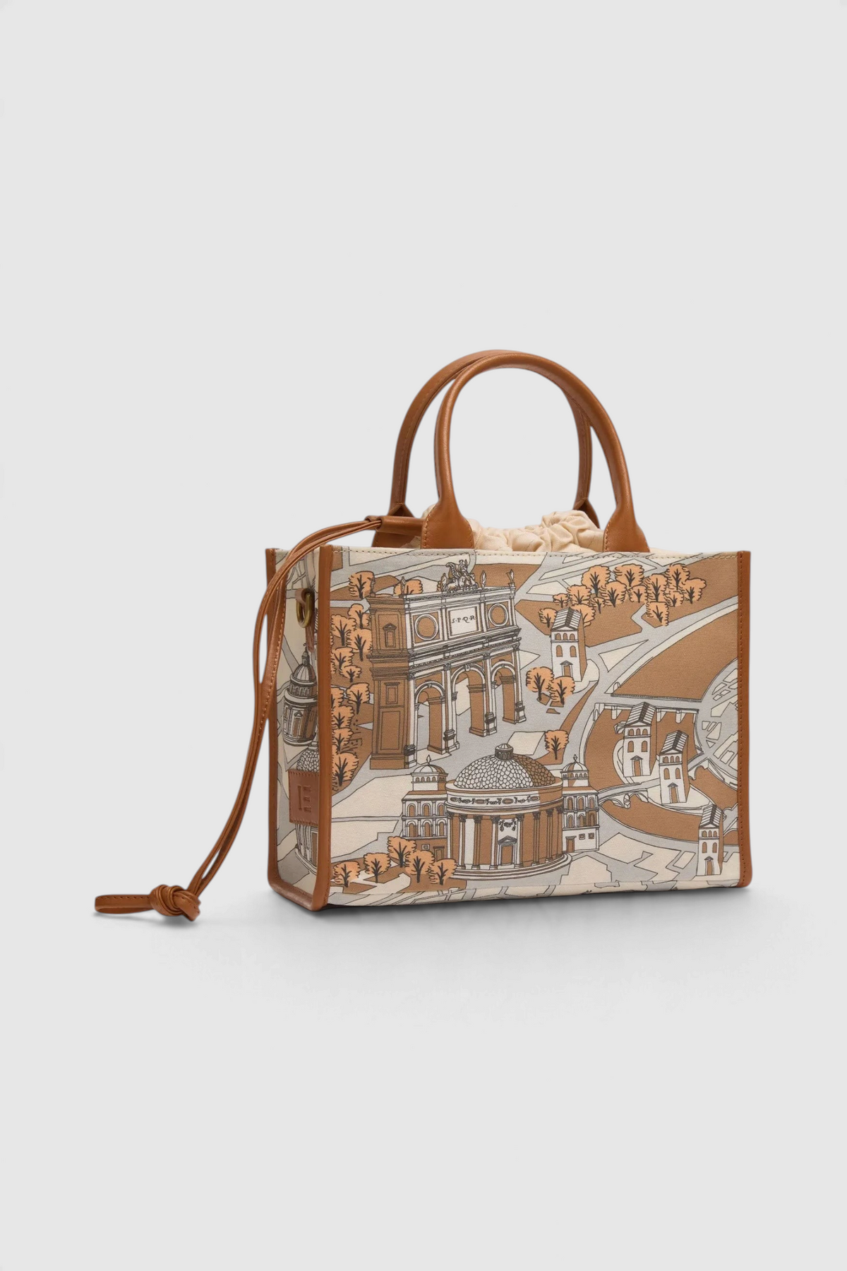 The Copper Shed Caprice Bag in Rome print featuring cotton canvas with brown Italian leather handles and trim.