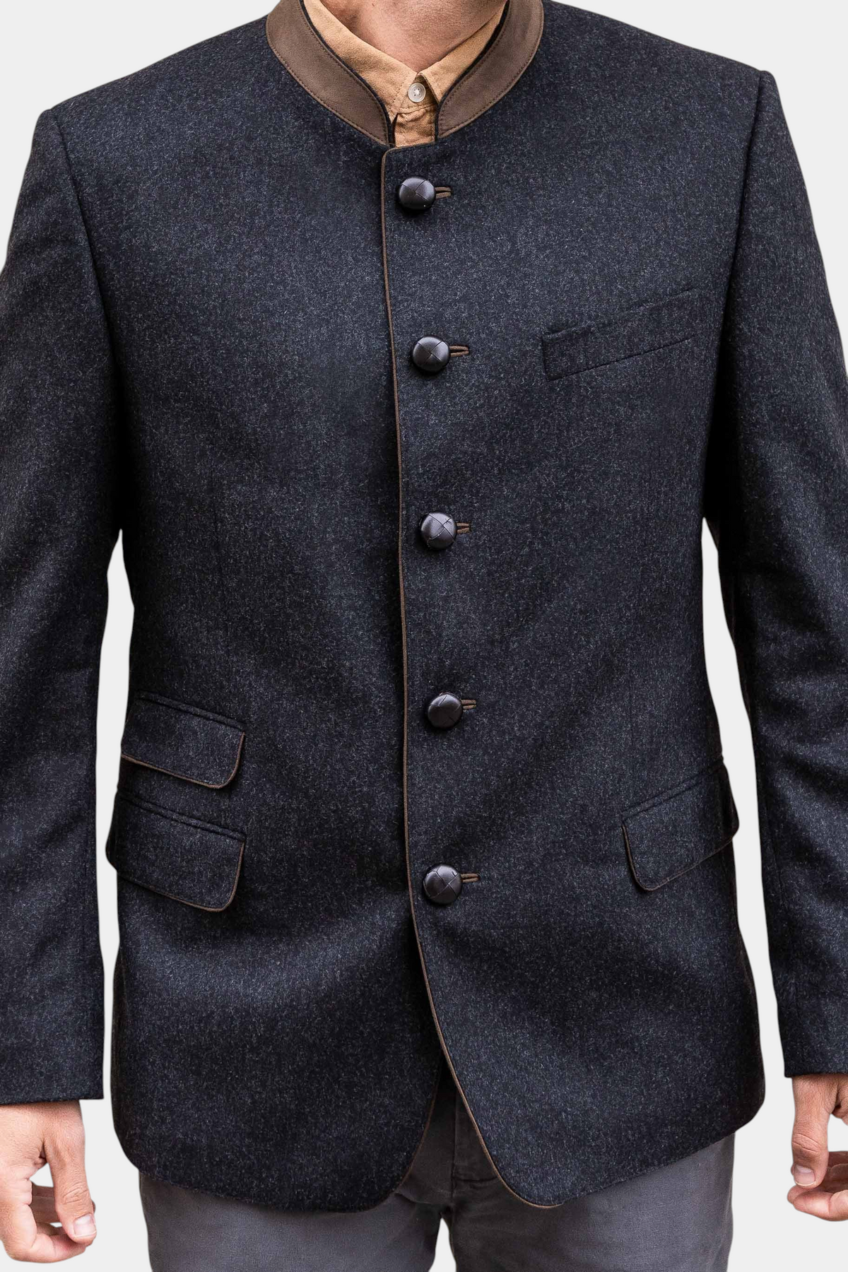 The Copper Shed Edward classic Austrian jacket in charcoal wool with a brown suede mandarin collar and leather buttons.