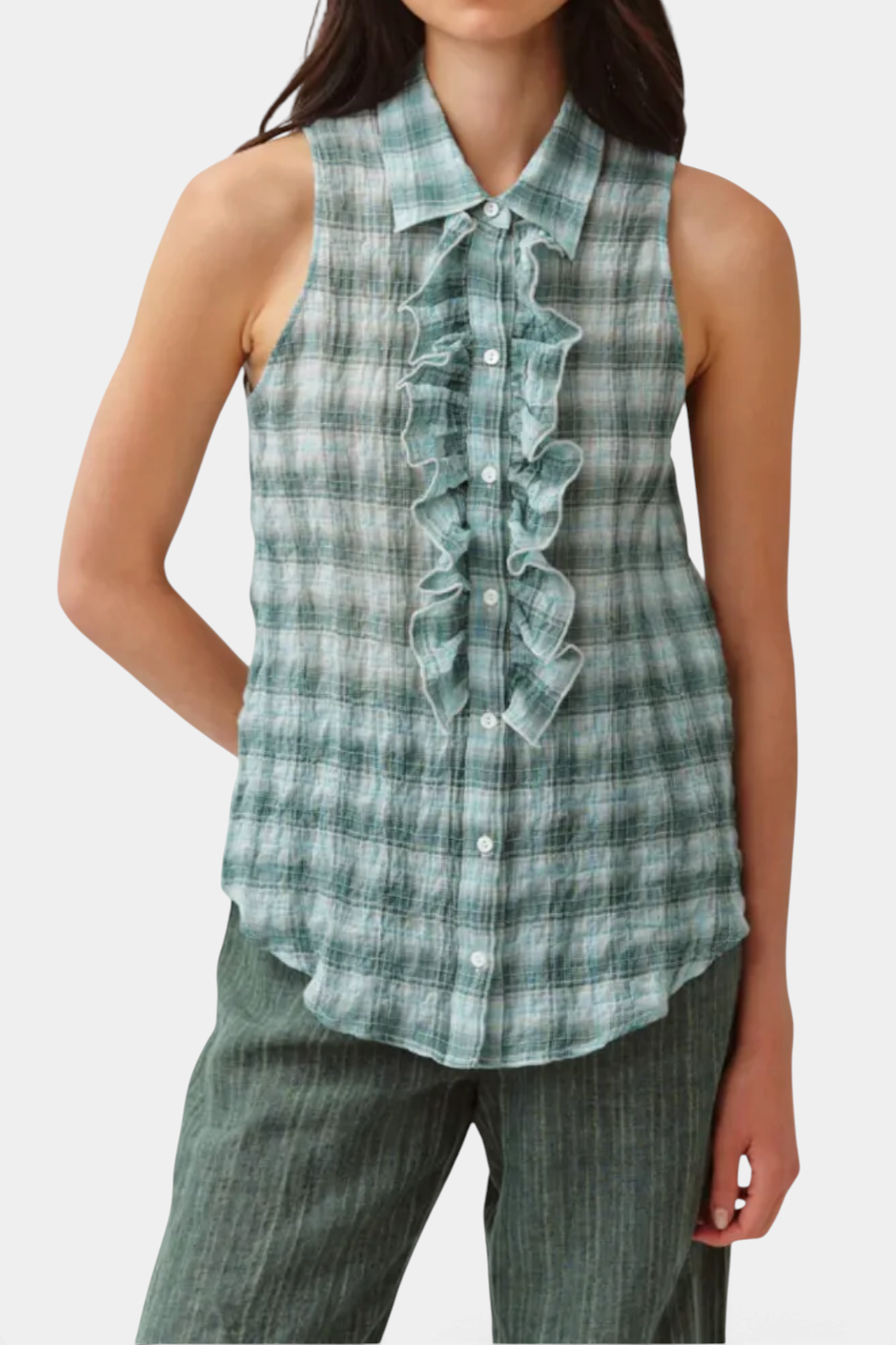 The Copper Shed Cheka Chemise sleeveless green plaid shirt with a ruffled jabot front and classic collar.