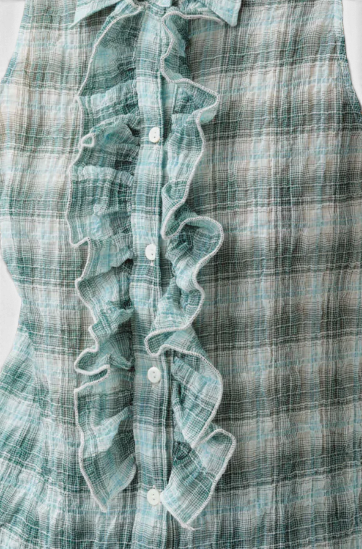 The Copper Shed Cheka Chemise sleeveless shirt in green and white plaid cotton with a ruffled jabot button placket.