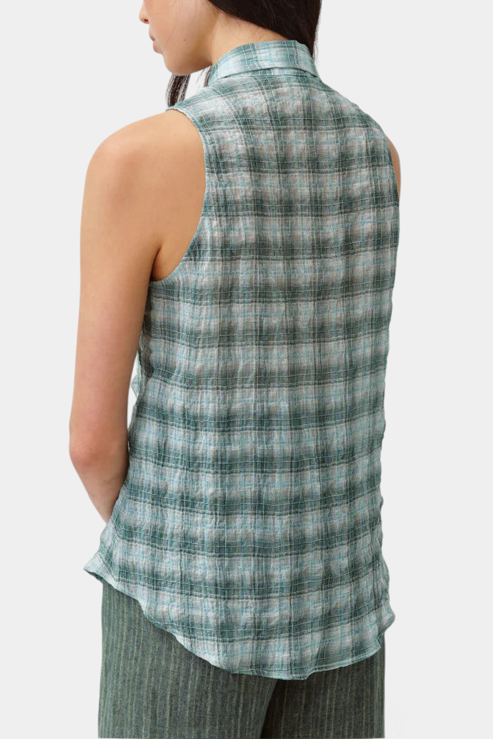 The Copper Shed Cheka Chemise sleeveless shirt in a green and white plaid cotton blend with a rounded hem, back view.