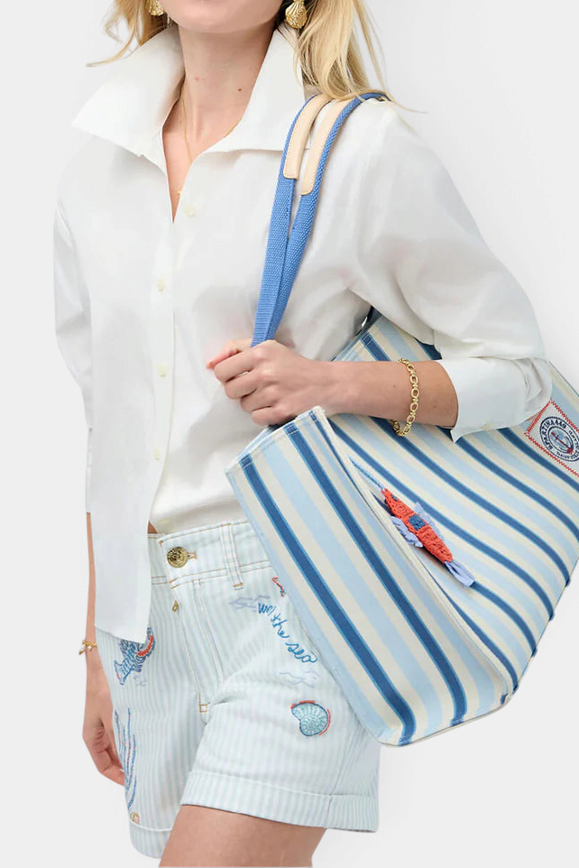 The Copper Shed pearl white stretch cotton Cher Blouse with long sleeves and a pop collar worn by a model.