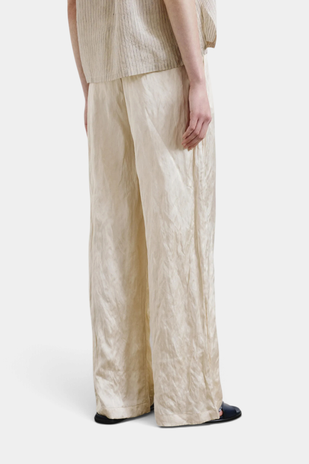 The Copper Shed crinkled viscose satin pants in champagne with an elastic waistband and relaxed wide-leg fit.