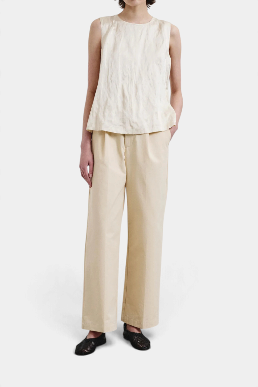 The Copper Shed sleeveless crinkled viscose satin top in cream worn with matching trousers