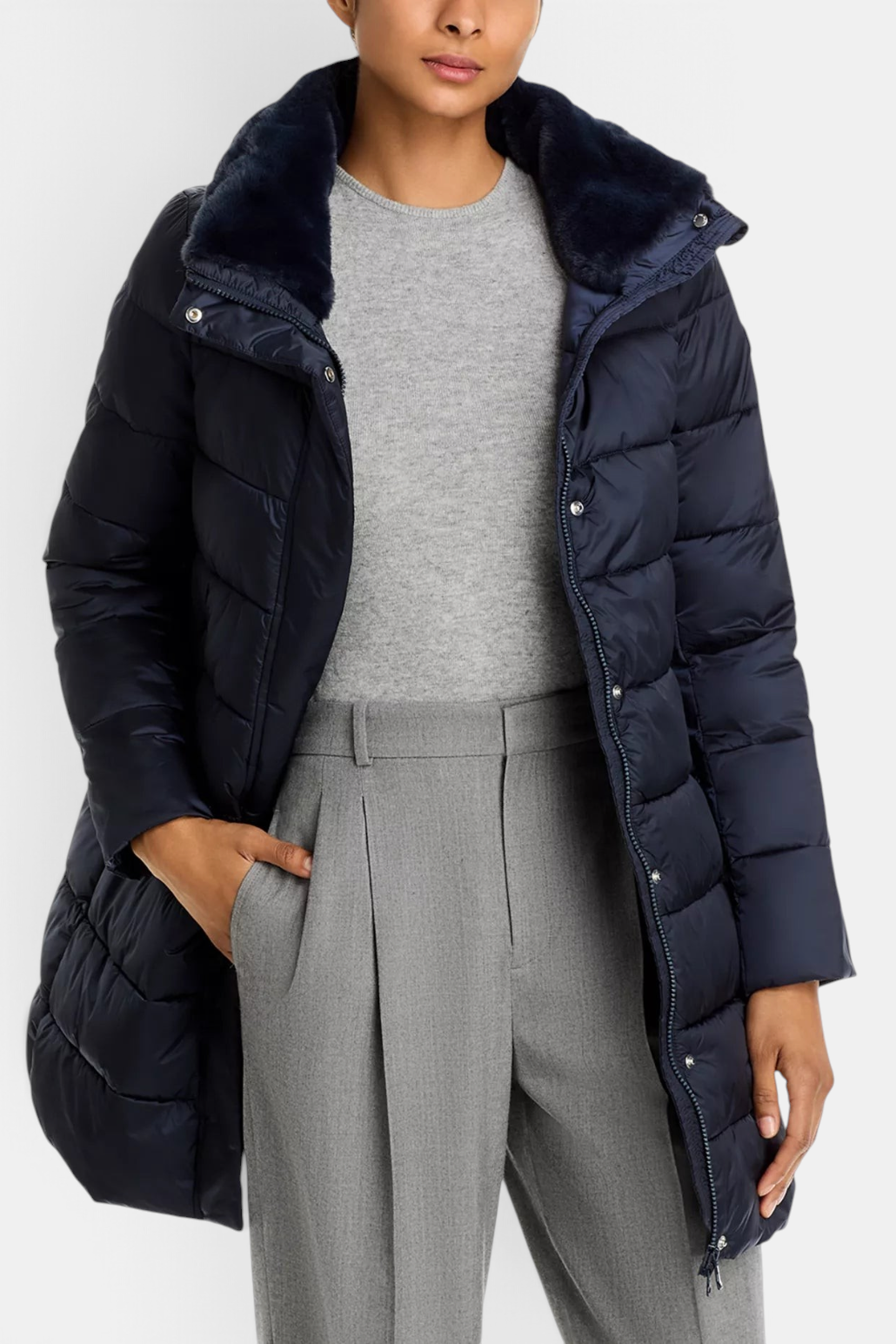 The Copper Shed Dalea navy puffer coat with channel quilting, water-repellent finish, and plush faux-fur stand collar.
